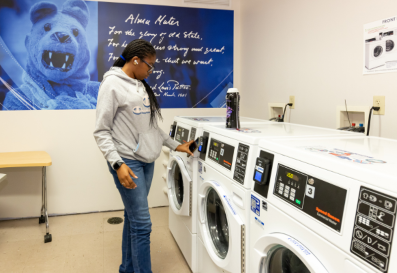 Student at washing machine