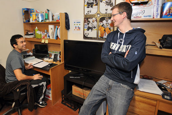 Two students in residence hall room