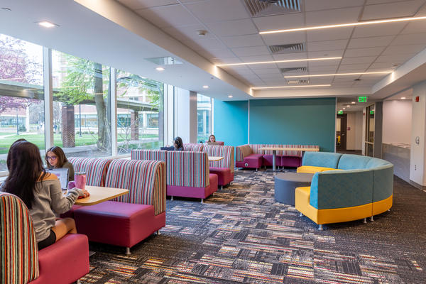 Geary residence hall common area with students studying