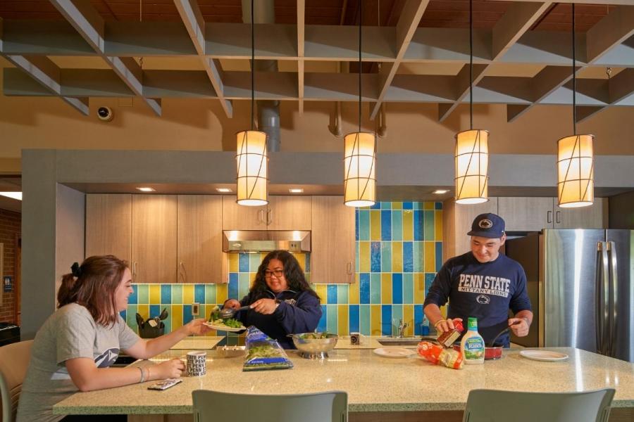 Three Students eating in South Hall Shared Kitchen 