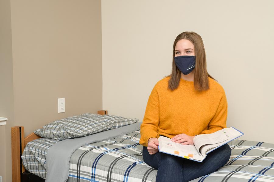 Trippe Hall Bedroom with mask and student