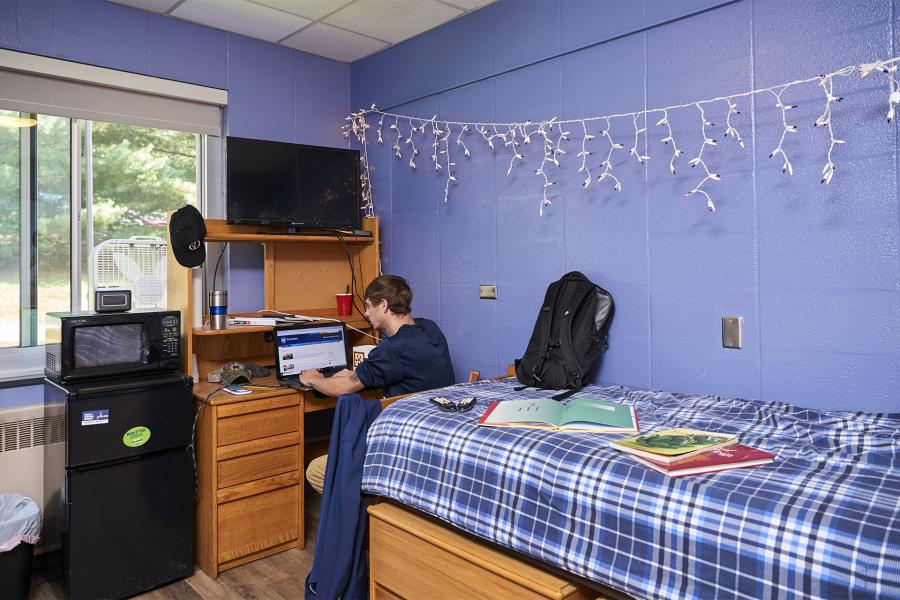 student in his single room in Mont Alto Hall