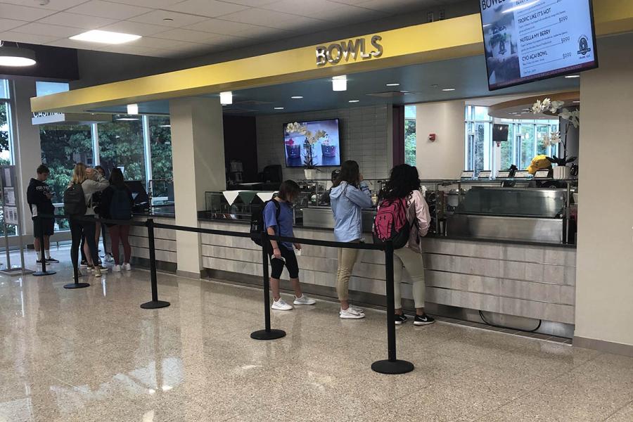 Students waiting in line at Bowls food counter