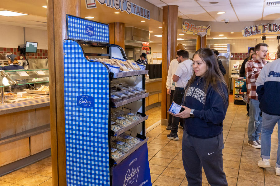 a student shops for Penn State Bakery items at Tullys at Berks campus