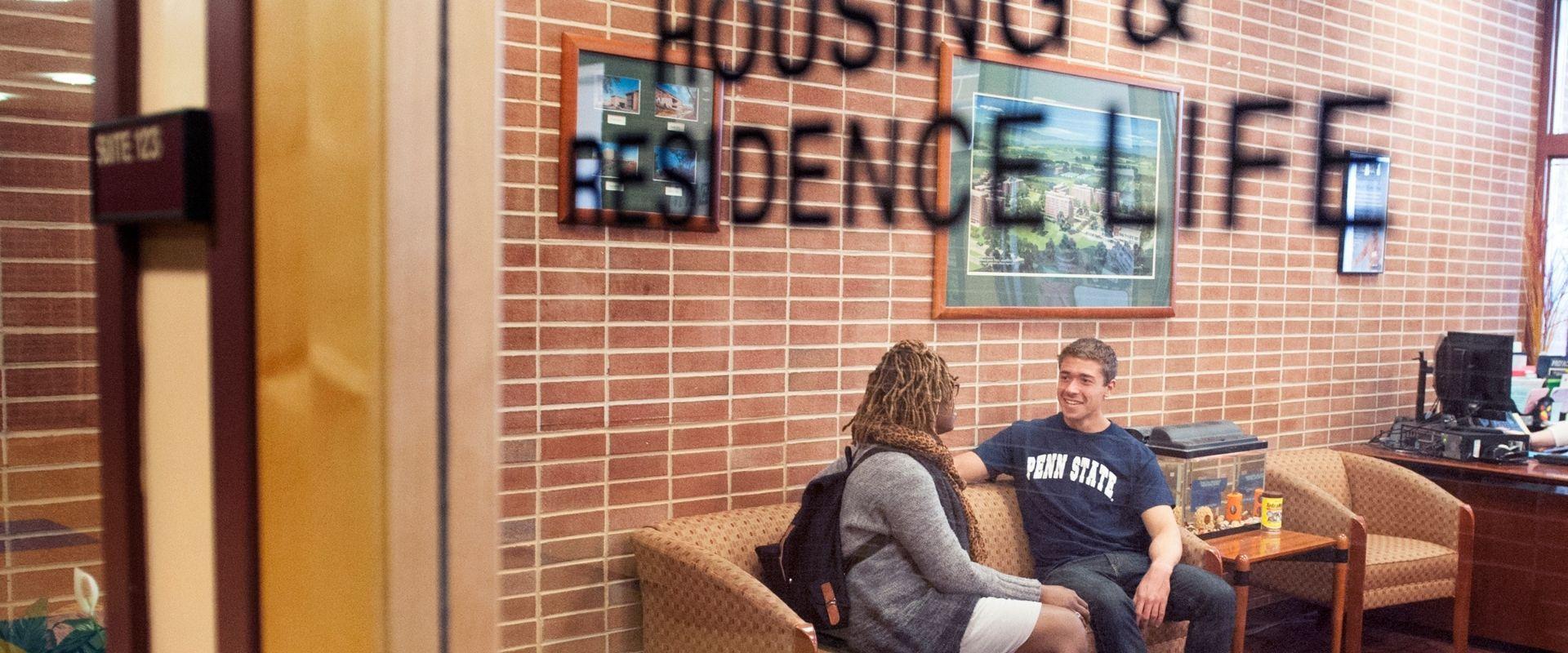 students sitting in residence life office 
