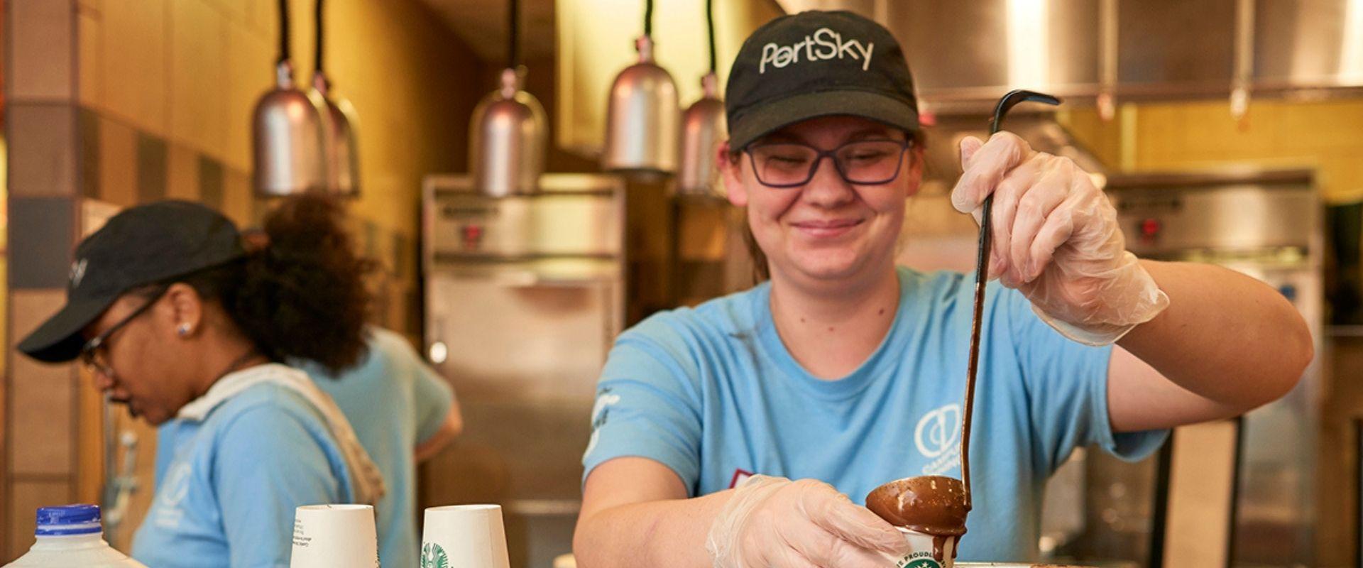 employee serving hot chocolate