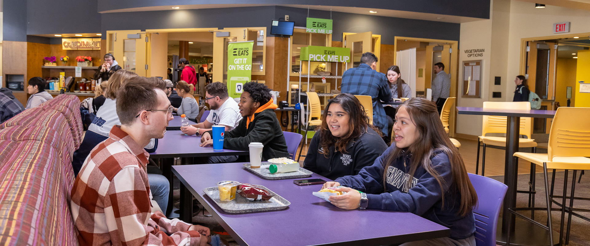 Students socializing in the dining area at Berks campus