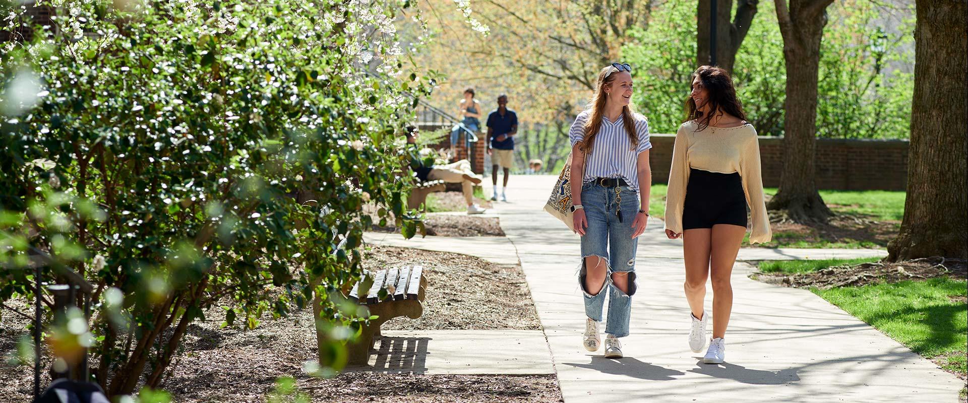 students walking near West Halls at University Park